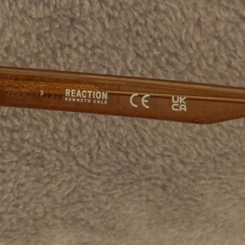Kenneth Cole Sunglasses, Brown & Silver Colored frame.